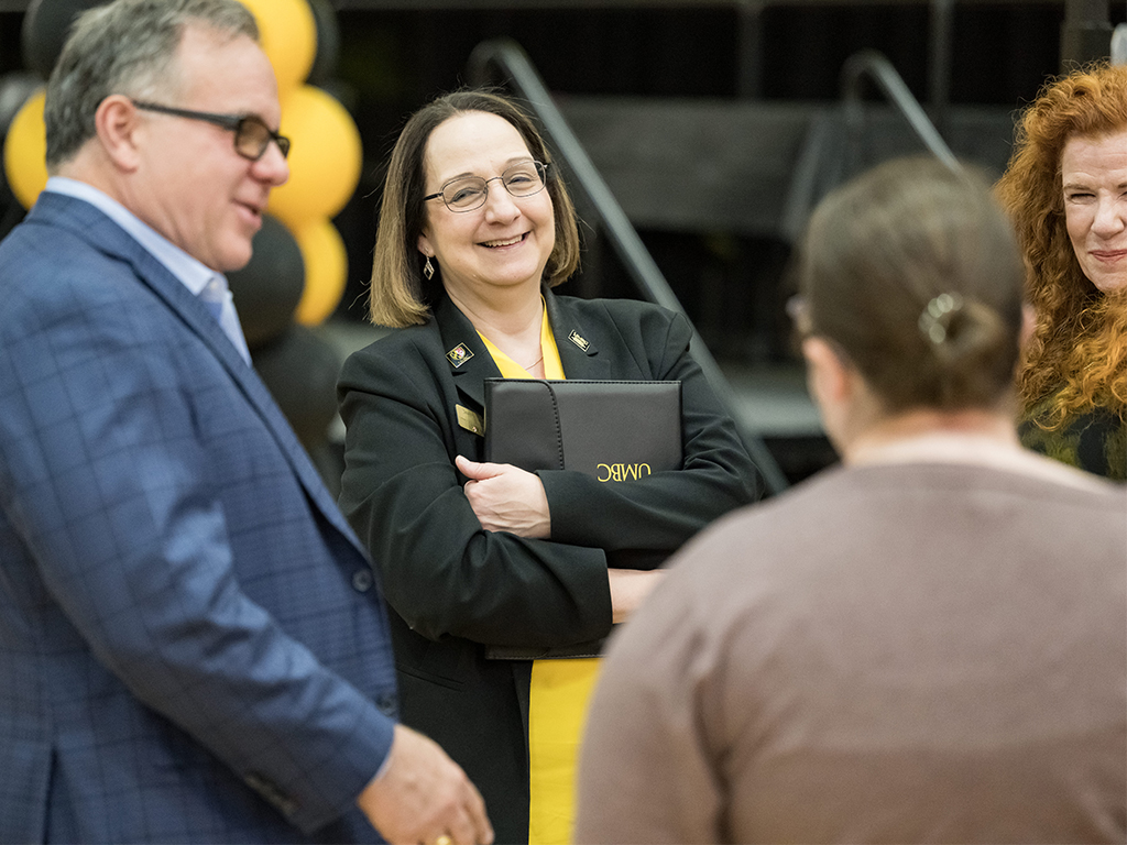 Group of four COEIT Celebration participants including Dean Jeanne van Briesen (center)