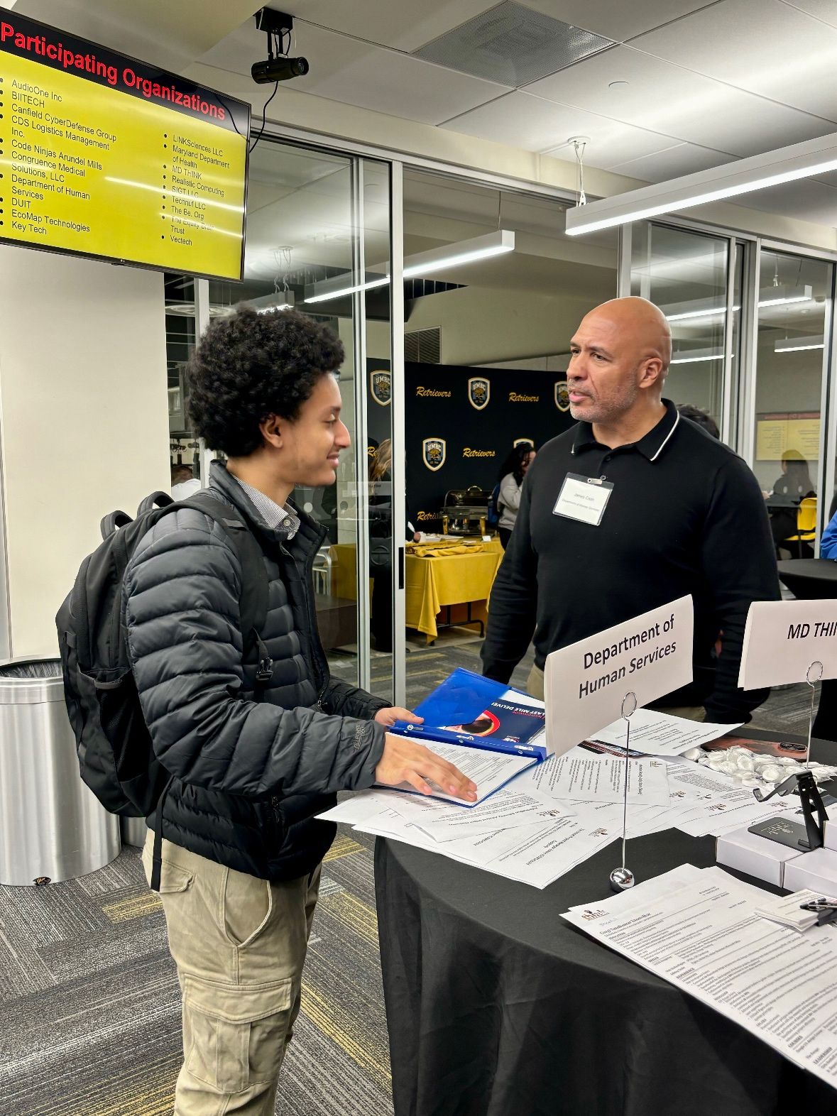 Student discussing positions with a State Agency Representative.