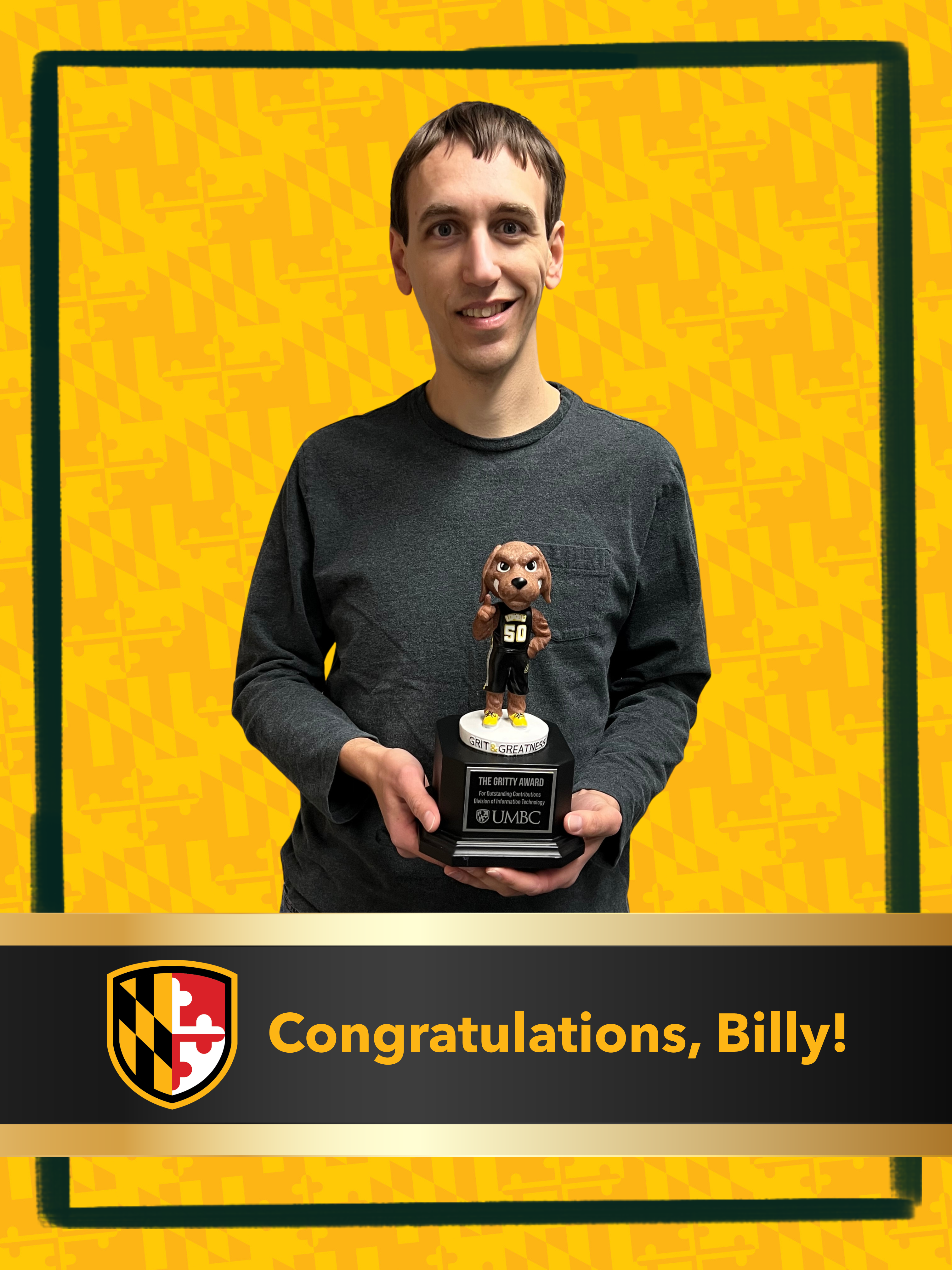 Billy is standing and holding the gritty dog trophy with the text banner underneath him stating "Congratulations Billy!"
