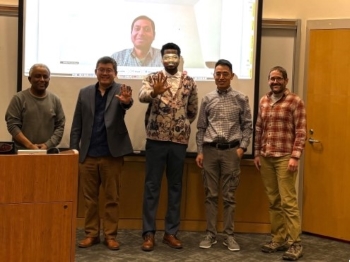 Group photo in the lecture room after Adeleke presented his dissertation. Caption provided.
