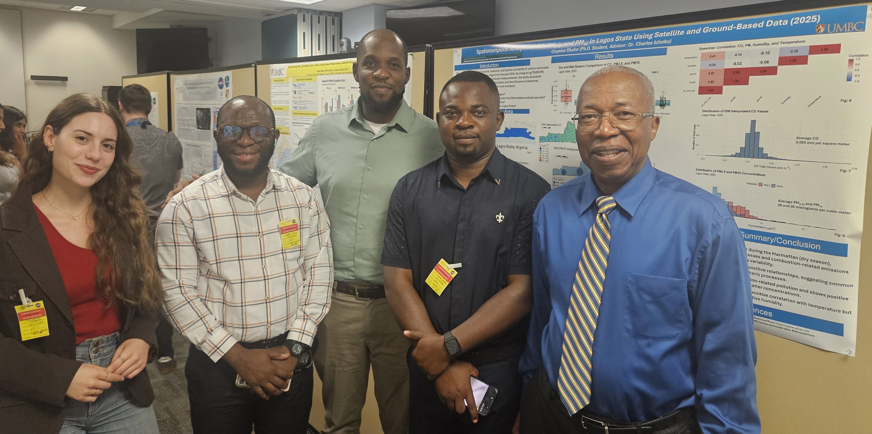 Dr. Ichoku and UMBC students stand in front of two posters led by 2 of the students, Enoch Damte and Onyema Okafor. Left to right: Margarida Reis, Enoch Damte, Onyema Okafor, Nathaniel Nwoke, and Dr. Charles Ichoku.