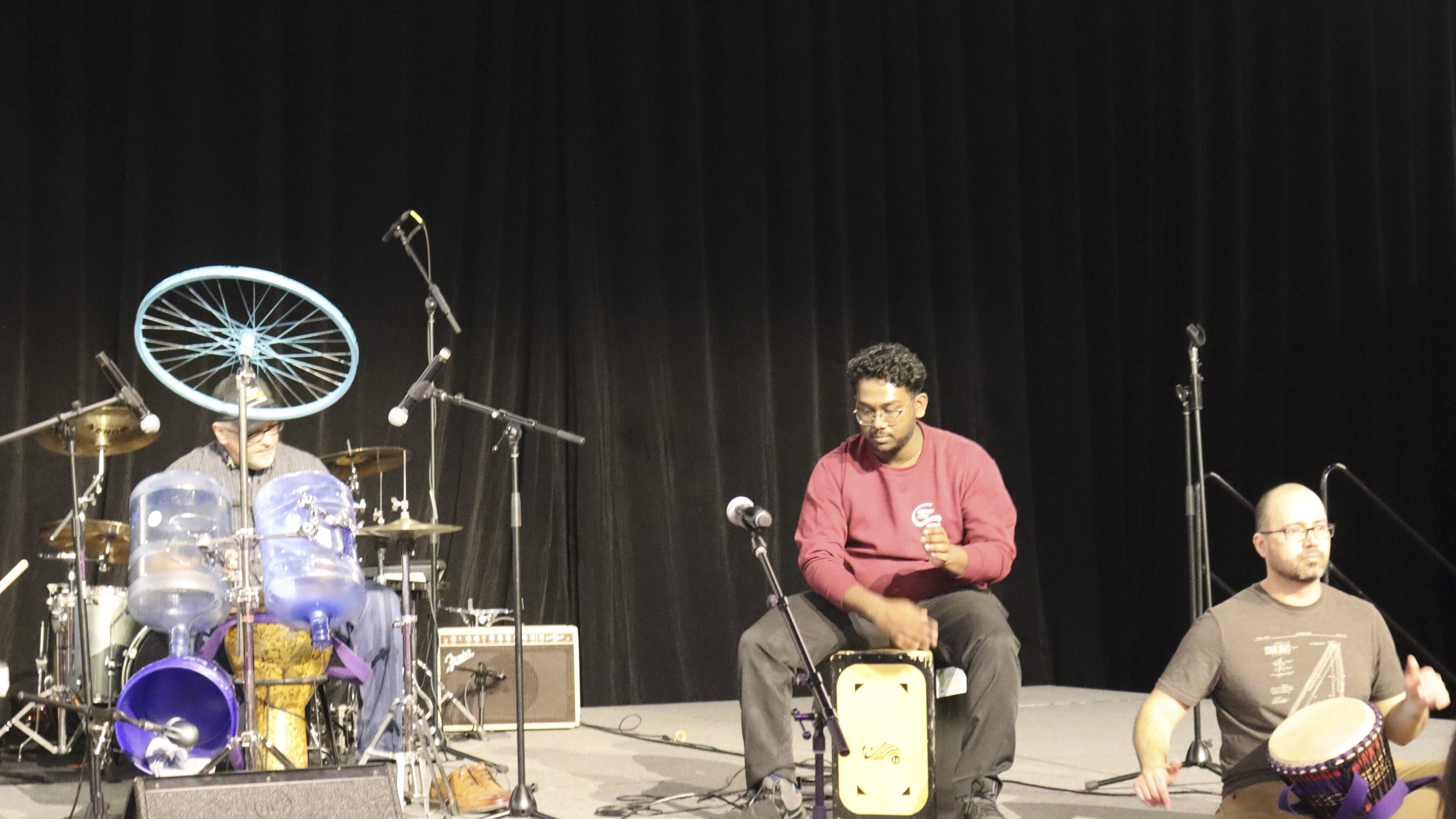 INDS team in the drum circle with the students