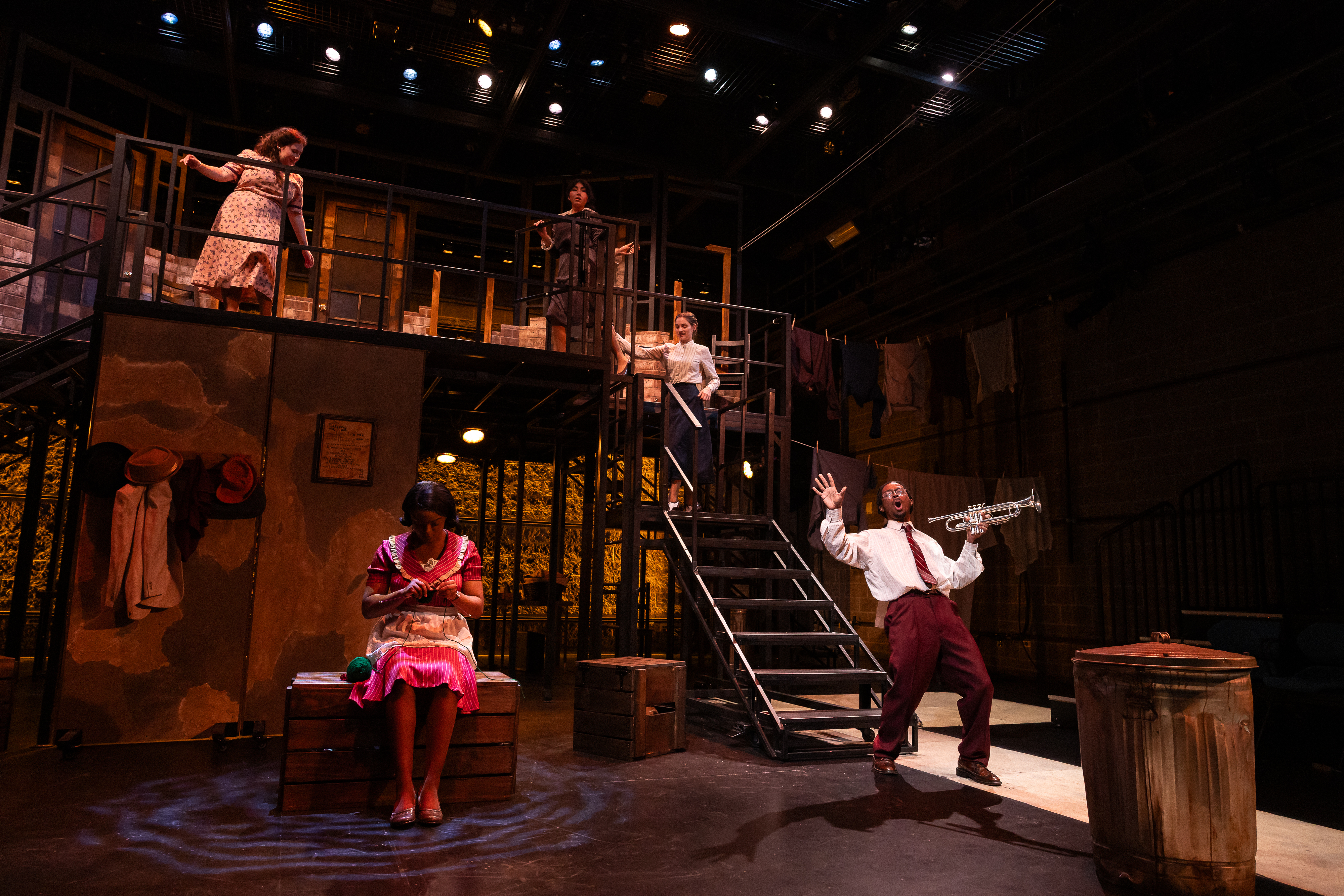 Production Photo from Street Scenes. Jim Jackson sings "Blow Gabriel Blow" with his trumpet. The other women in the ensemble sing back up.