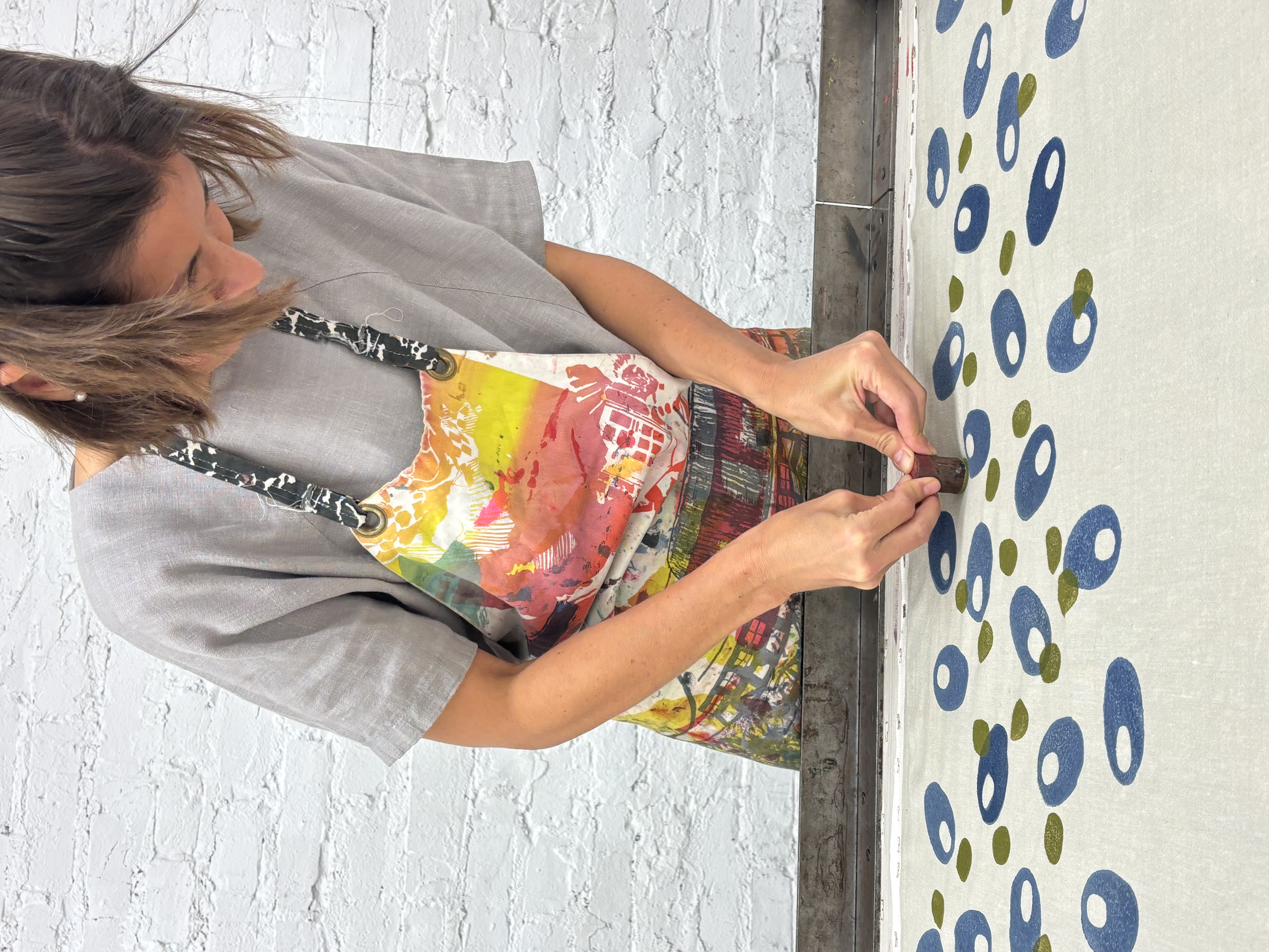 Artist Sunaina Bhalla demonstrating traditional block printing methods