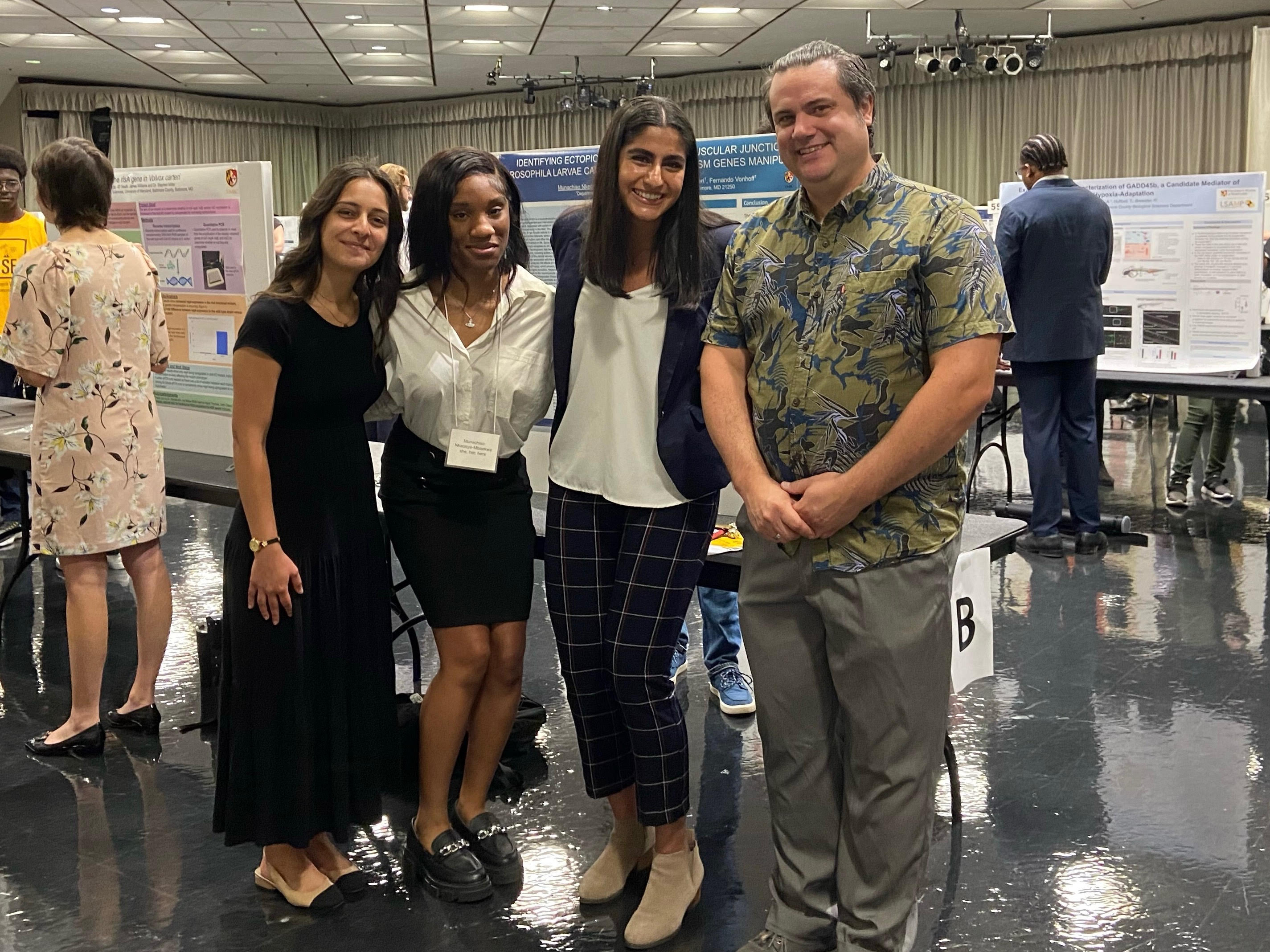Shreya with fellow students from the Vonhoff Lab smiling in the University Ballroom