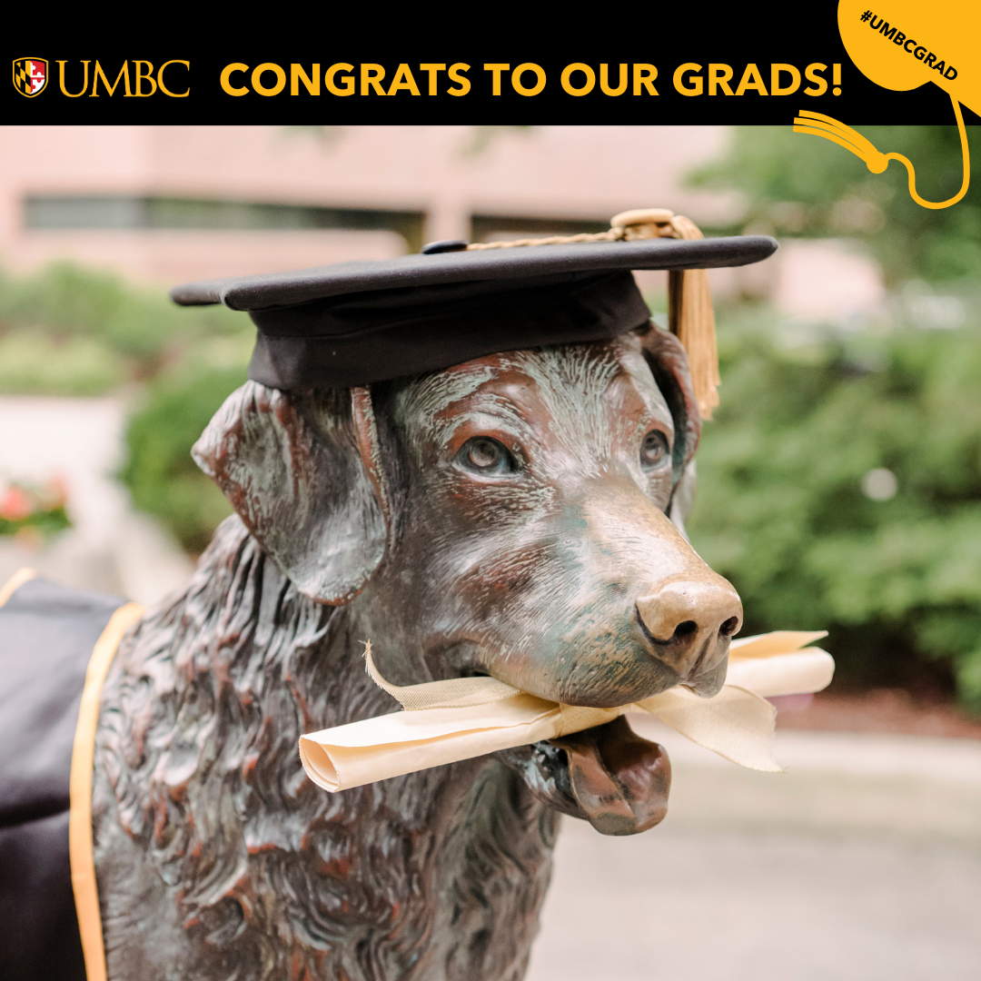 true grit statue with diploma