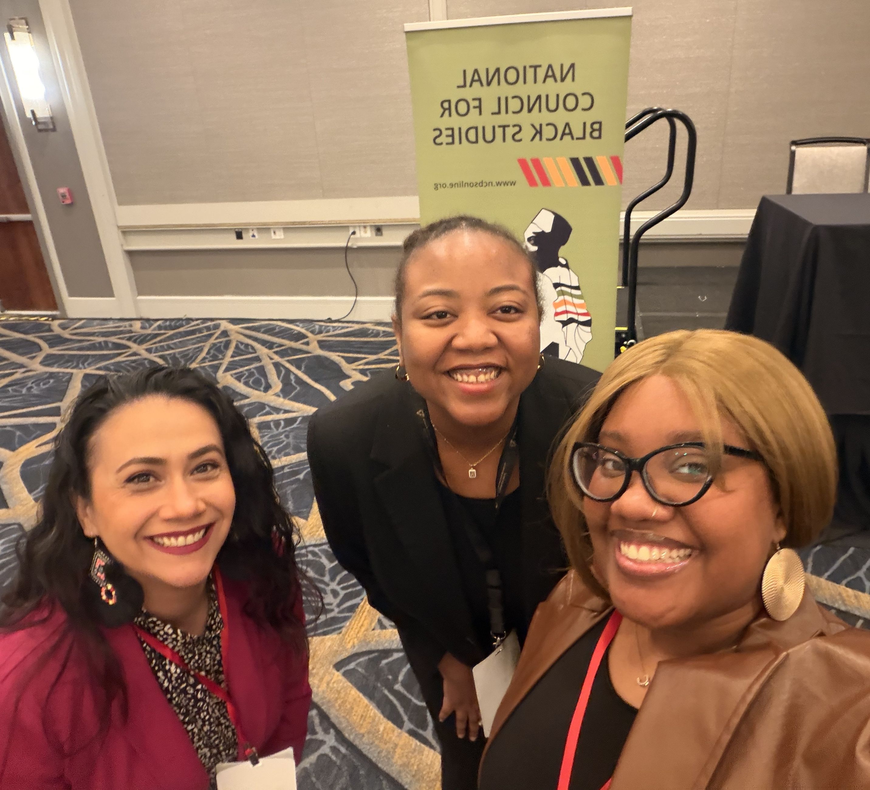 Three women smiling