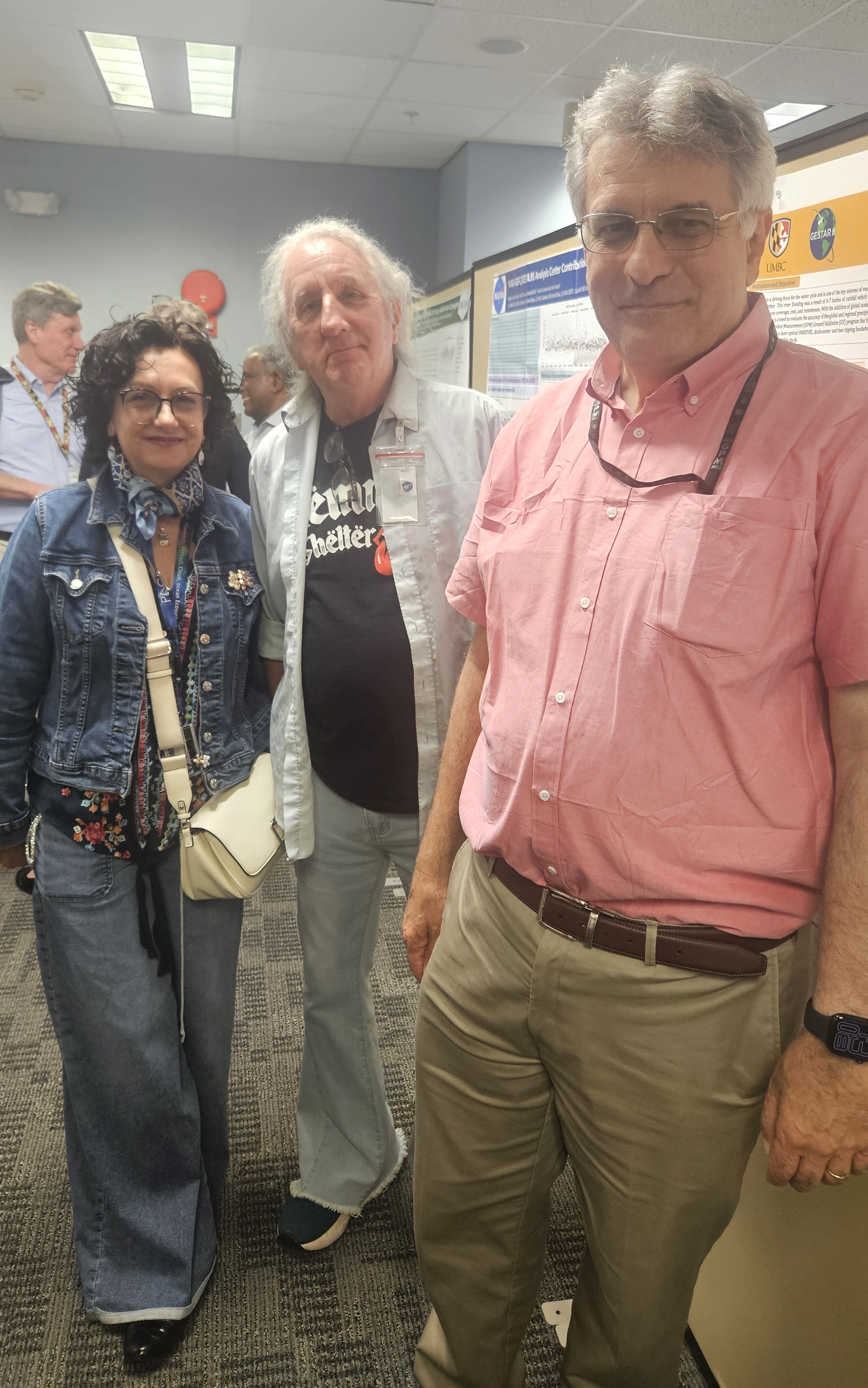 Dr. Magda Kuzmicz-Cieslak, Mr. Keith Evans, and Dr. Ali Tokay explore the research posters.